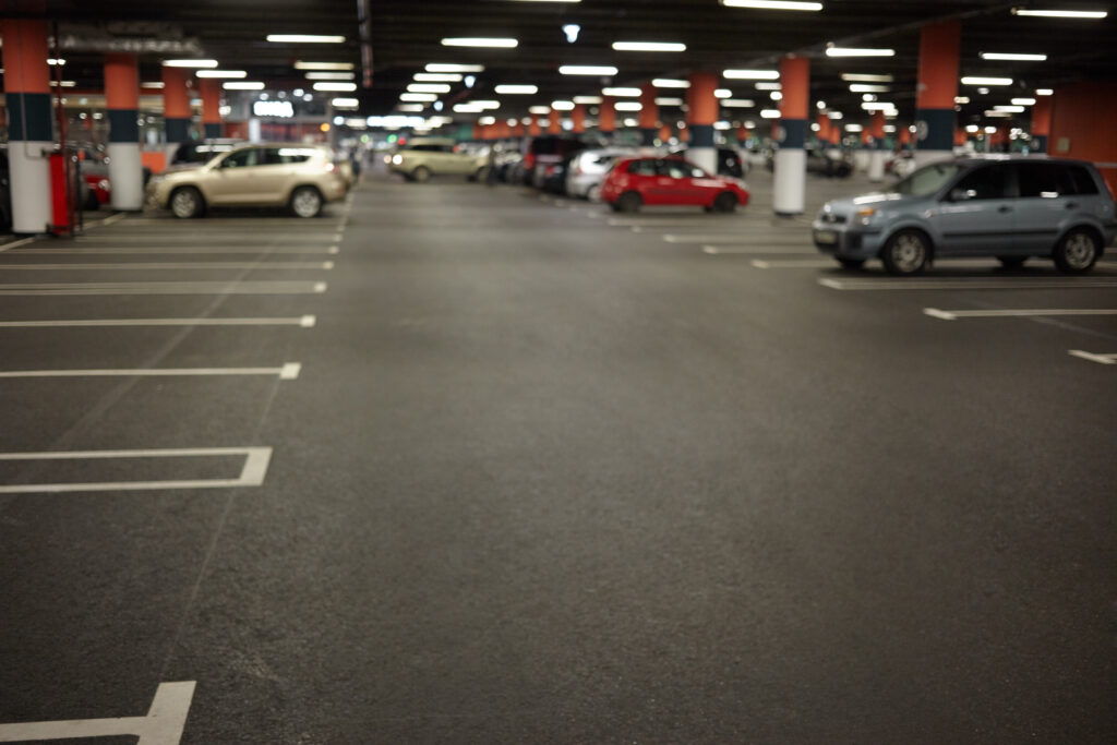 horizontal picture car parking underground garage interior with neon lights autocars parked buildings urban constructions space transportation vehicle night city concept